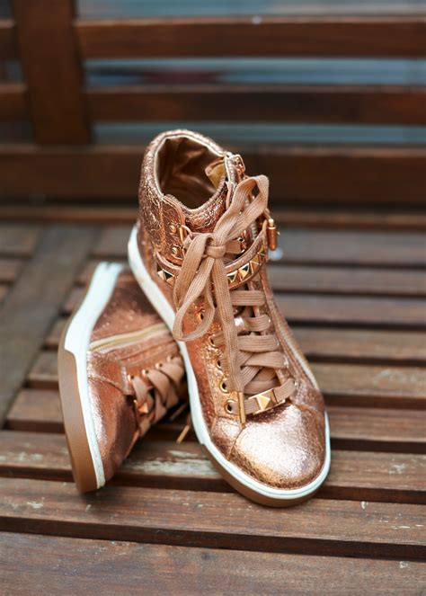 rose gold high top sneakers.